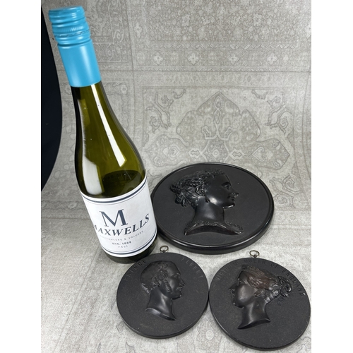 25 - Victoria and Albert portrait plaques in bois durci, diameter 11cm and a larger bust plaque of side p... 