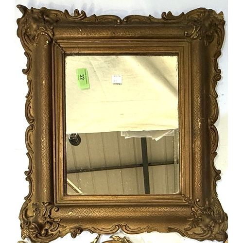 32 - A small square gilt framed mirror; an ornate gilt metal freestanding mirror etc