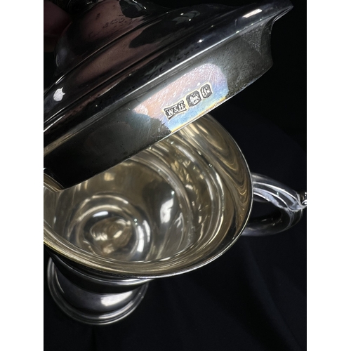 532 - A hallmarked silver twin handled covered trophy cup with circular pedestal base, Sheffield 1923, 13.... 