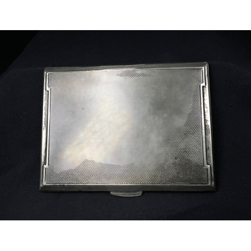 543 - An engine turned hallmarked silver cigarette case, Birmingham 1943, 5.5ozt