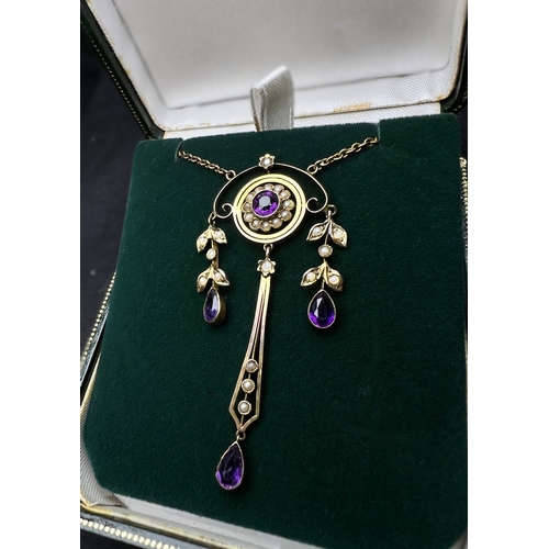 548 - An Art Nouveau pendant set with amethyst and seed pearls, stamped 9c on fine chain (pendant approx. ... 