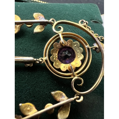 548 - An Art Nouveau pendant set with amethyst and seed pearls, stamped 9c on fine chain (pendant approx. ... 