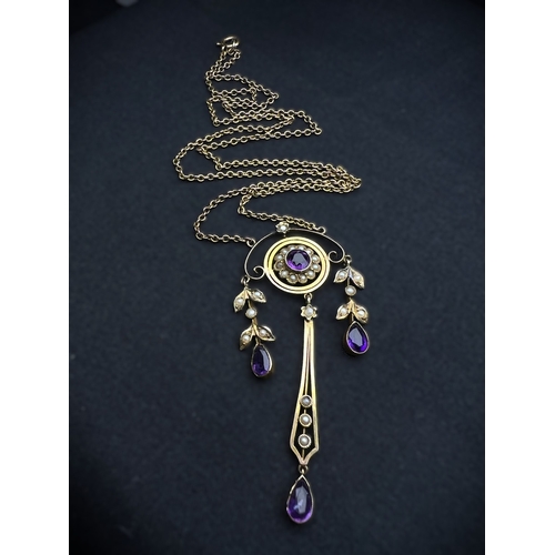 548 - An Art Nouveau pendant set with amethyst and seed pearls, stamped 9c on fine chain (pendant approx. ... 