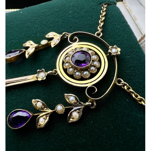 548 - An Art Nouveau pendant set with amethyst and seed pearls, stamped 9c on fine chain (pendant approx. ... 