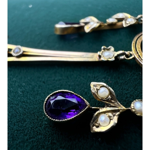 548 - An Art Nouveau pendant set with amethyst and seed pearls, stamped 9c on fine chain (pendant approx. ... 