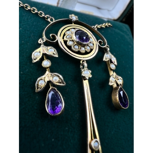 548 - An Art Nouveau pendant set with amethyst and seed pearls, stamped 9c on fine chain (pendant approx. ... 
