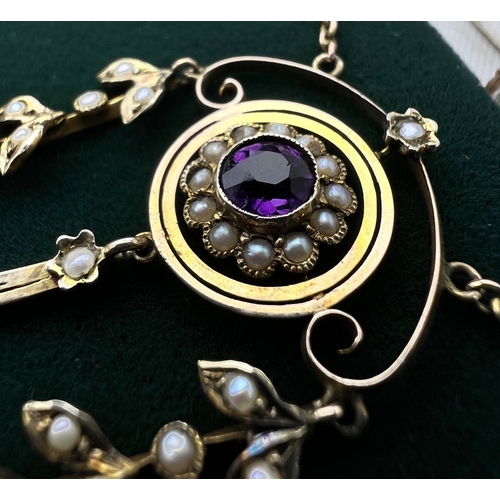 548 - An Art Nouveau pendant set with amethyst and seed pearls, stamped 9c on fine chain (pendant approx. ... 