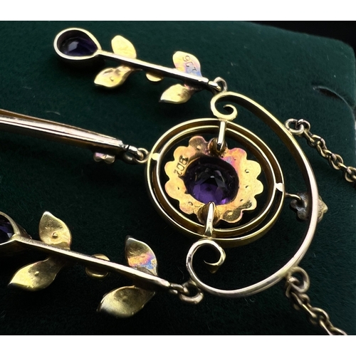 548 - An Art Nouveau pendant set with amethyst and seed pearls, stamped 9c on fine chain (pendant approx. ... 