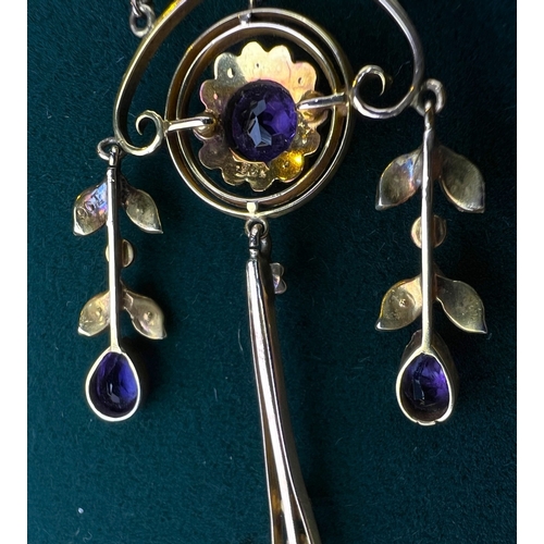 548 - An Art Nouveau pendant set with amethyst and seed pearls, stamped 9c on fine chain (pendant approx. ... 