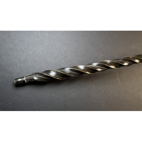 552 - An 18th century punch ladle with inset George II coin, with embossed decoration and twisted bone han... 