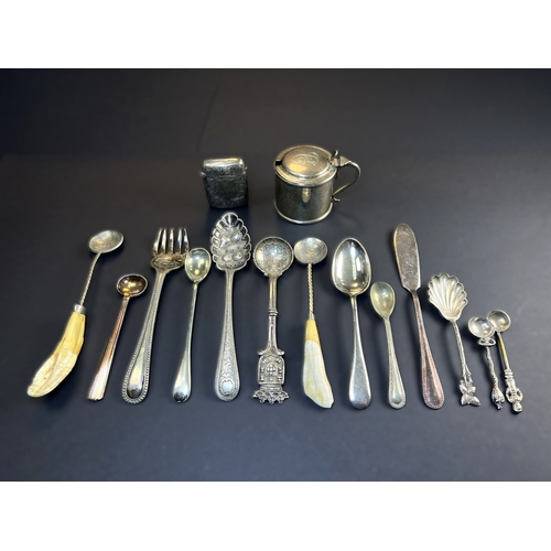 557 - A circular monogrammed mustard pot with blue glass liner, London 1898; a chased hallmarked silver ve... 