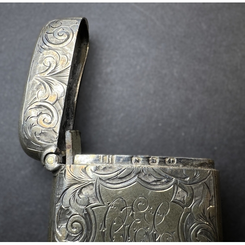 557 - A circular monogrammed mustard pot with blue glass liner, London 1898; a chased hallmarked silver ve... 