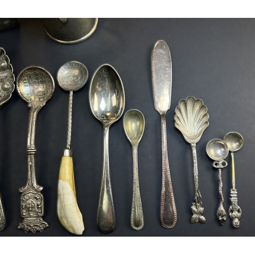 557 - A circular monogrammed mustard pot with blue glass liner, London 1898; a chased hallmarked silver ve... 