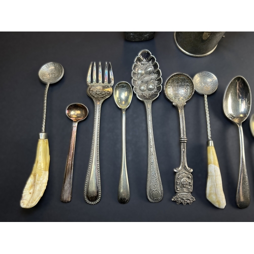 557 - A circular monogrammed mustard pot with blue glass liner, London 1898; a chased hallmarked silver ve... 