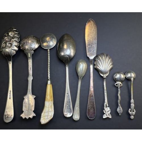 557 - A circular monogrammed mustard pot with blue glass liner, London 1898; a chased hallmarked silver ve... 