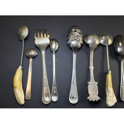 557 - A circular monogrammed mustard pot with blue glass liner, London 1898; a chased hallmarked silver ve... 