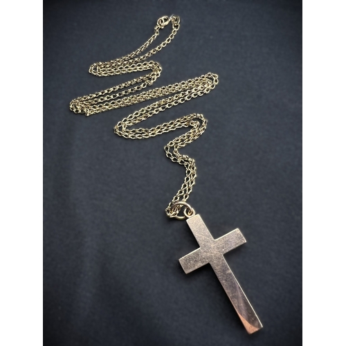 597 - A 9 carat hallmarked gold double link chain with cross stamped '9ct, 8.2gm, chain length 35cm