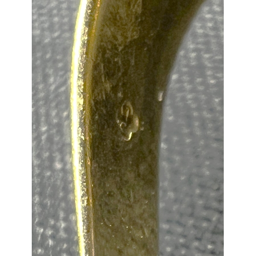 598A - A 9 carat hallmarked gold signet ring set oval black stone, size N, (shank slightly bent), 4.7gm