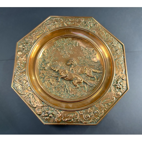 60 - A 19th century shallow copper dish embossed hunting scene of two dogs octagonal border with dragons ... 