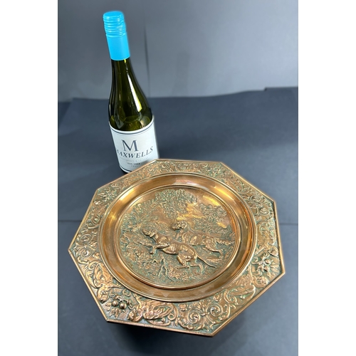 60 - A 19th century shallow copper dish embossed hunting scene of two dogs octagonal border with dragons ... 
