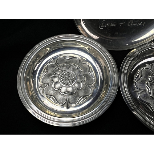 608 - A pair of small circular hallmarked silver dishes each decorated with a rose, London 1926; a small C... 