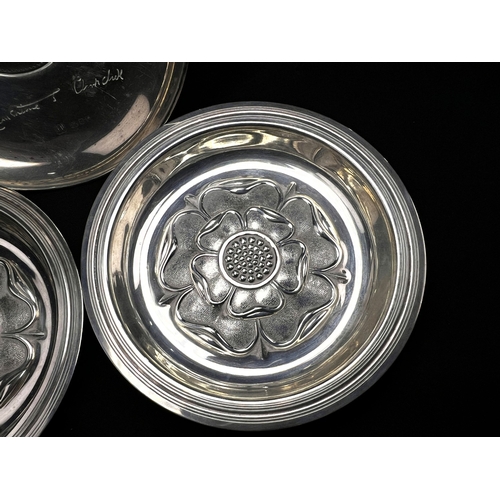 608 - A pair of small circular hallmarked silver dishes each decorated with a rose, London 1926; a small C... 