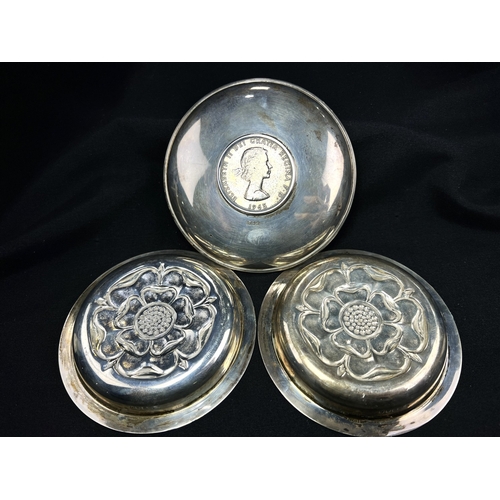 608 - A pair of small circular hallmarked silver dishes each decorated with a rose, London 1926; a small C... 