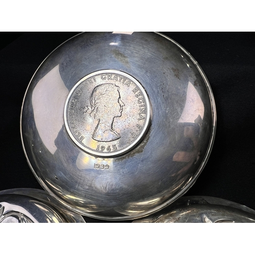 608 - A pair of small circular hallmarked silver dishes each decorated with a rose, London 1926; a small C... 