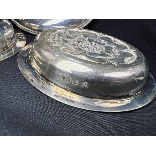 608 - A pair of small circular hallmarked silver dishes each decorated with a rose, London 1926; a small C... 