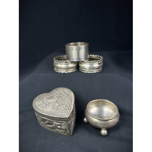 613 - A pair of chased hallmarked silver napkin rings; an engine turned pair of napkin rings; a hms salt o... 