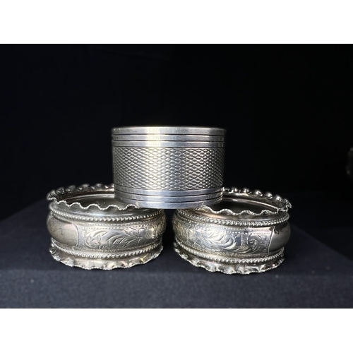 613 - A pair of chased hallmarked silver napkin rings; an engine turned pair of napkin rings; a hms salt o... 