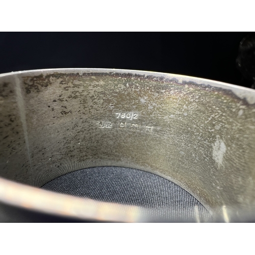 613 - A pair of chased hallmarked silver napkin rings; an engine turned pair of napkin rings; a hms salt o... 