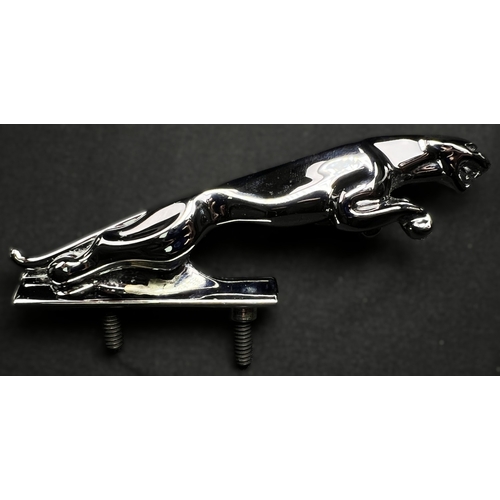 62 - A chrome Jaguar car mascot and a pair of boxed Jaguar cufflinks