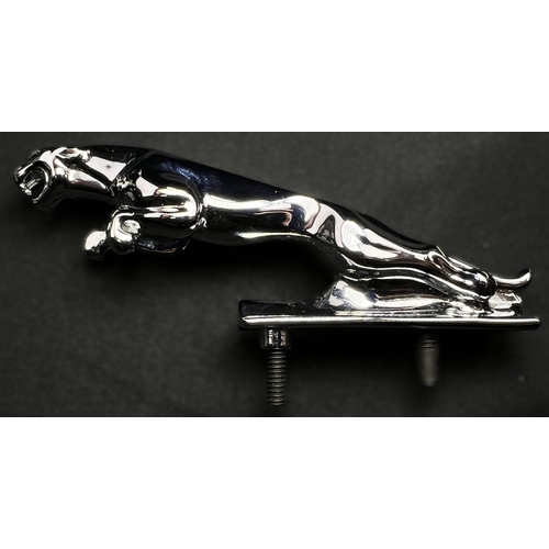 62 - A chrome Jaguar car mascot and a pair of boxed Jaguar cufflinks