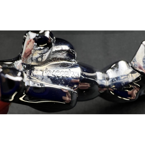 62 - A chrome Jaguar car mascot and a pair of boxed Jaguar cufflinks