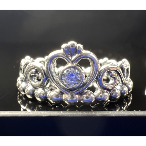 627 - Four silver Pandora rings, 3 with clear stones, sizes J & K, 11.7 gms.