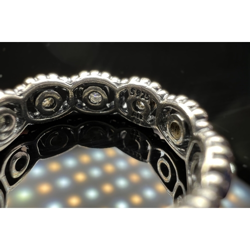 627 - Four silver Pandora rings, 3 with clear stones, sizes J & K, 11.7 gms.