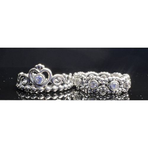 627 - Four silver Pandora rings, 3 with clear stones, sizes J & K, 11.7 gms.