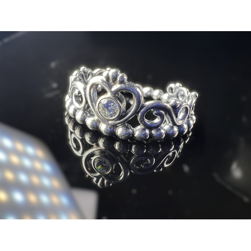 627 - Four silver Pandora rings, 3 with clear stones, sizes J & K, 11.7 gms.