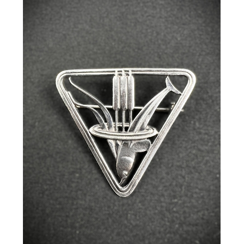 629 - GEORG JENSEN: a triangular silver brooch with dolphin diving through bullrushes, stamped to reverse ... 