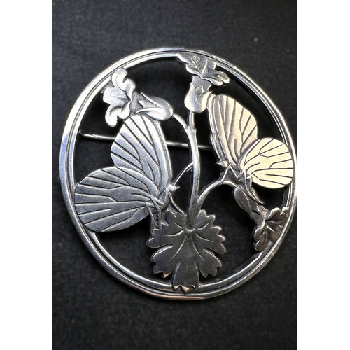 630 - GEORG JENSEN: a circular silver brooch Moonlight Blossom, designed by Arno Malinowski, butterflies p... 