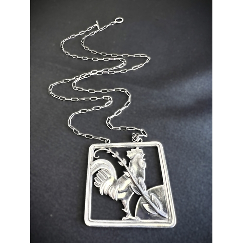 630A - GEORG JENSEN: a square silver pendant with a cockerel and fern, stamped to reverse GJ 925 STERLING D... 