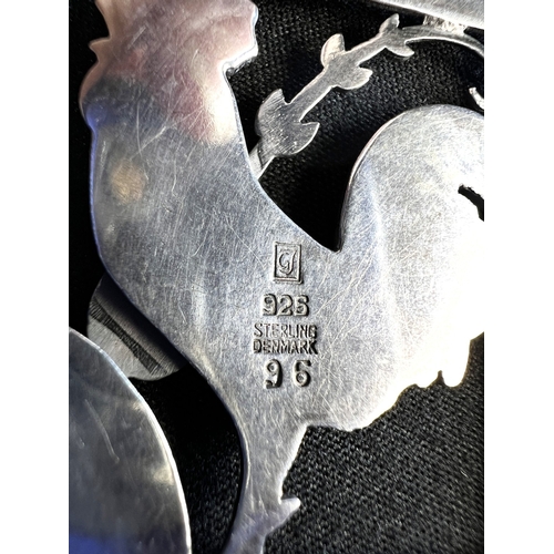630A - GEORG JENSEN: a square silver pendant with a cockerel and fern, stamped to reverse GJ 925 STERLING D... 