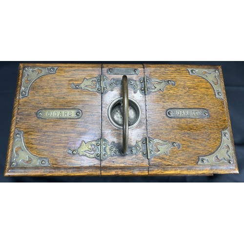 65 - A Victorian oak humidor / smoking companion, space for cigars, cigarettes, matches etc and two other... 