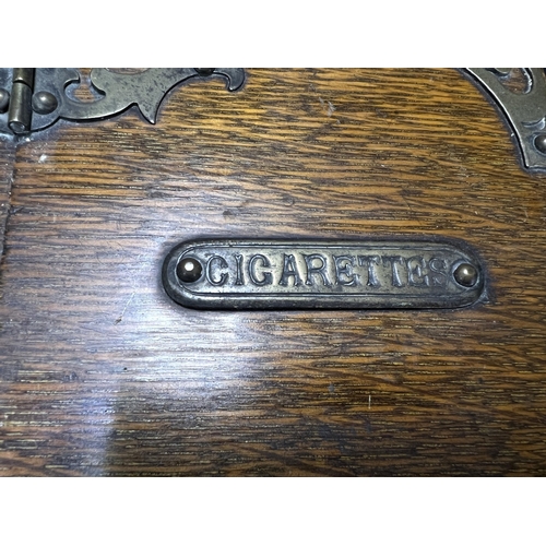 65 - A Victorian oak humidor / smoking companion, space for cigars, cigarettes, matches etc and two other... 