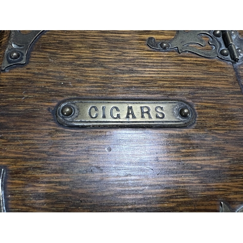 65 - A Victorian oak humidor / smoking companion, space for cigars, cigarettes, matches etc and two other... 