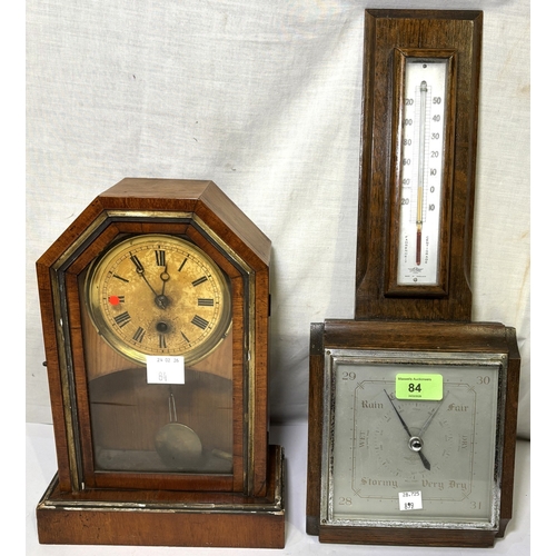 84 - A 1930's oak wall hanging barometer with thermometer; a late 19th century stained wood mantel clock
