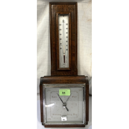 84 - A 1930's oak wall hanging barometer with thermometer; a late 19th century stained wood mantel clock