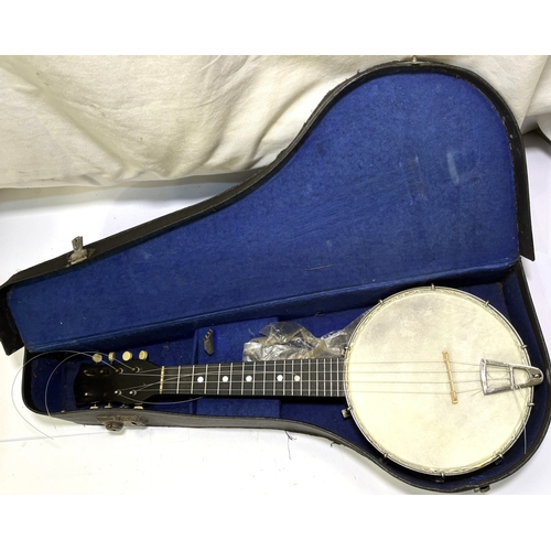91 - A cased UKELELE banjo/mandolin.