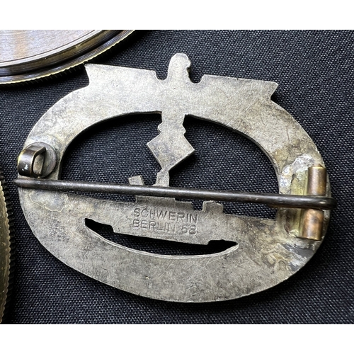 190A - A WWII period German U-boat Kriegsmarine badge, marked Schwerin to the reverse, and a reproduction c... 